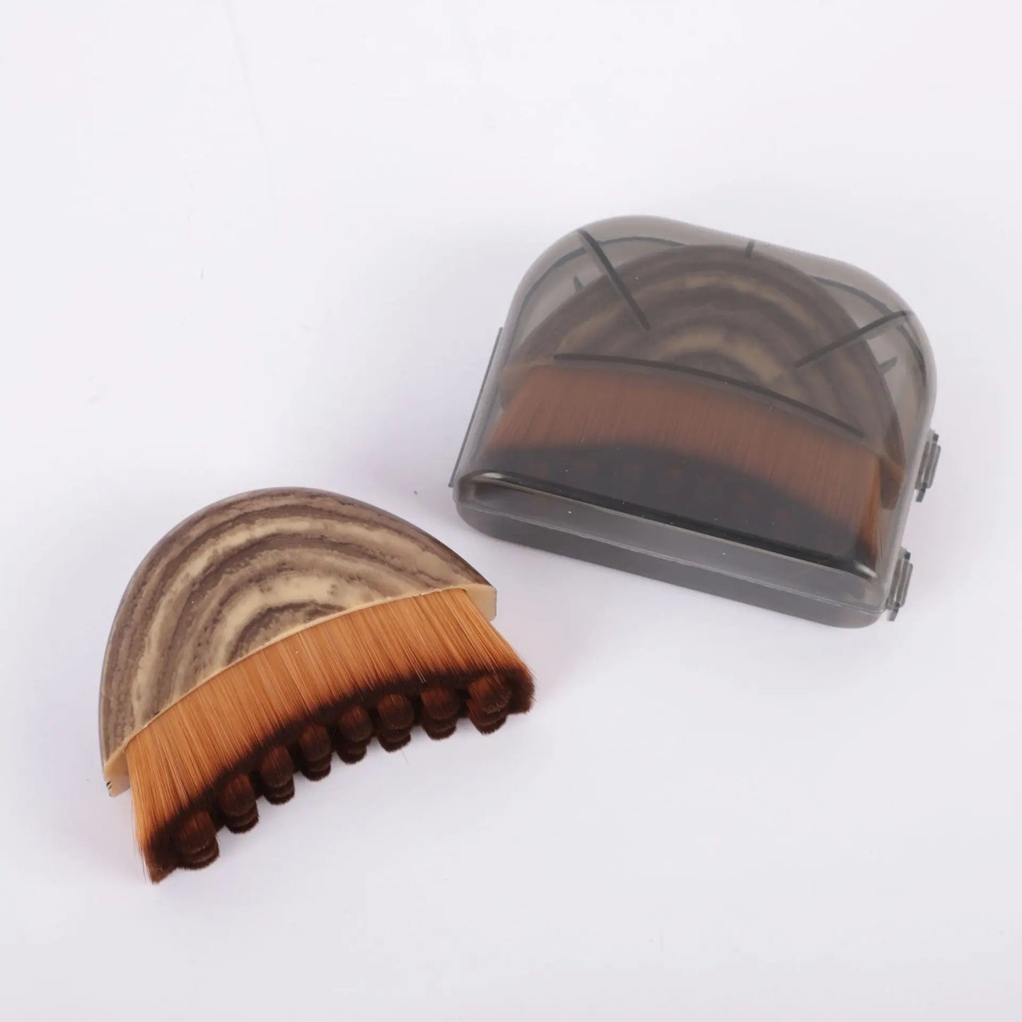SculptSweep contour face brush with curved handle and soft dense bristles